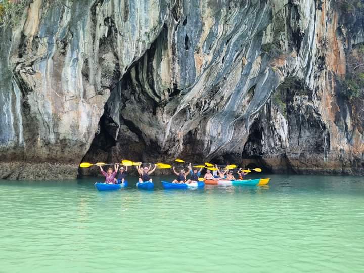 Traditional Thai boat in crystal clear water